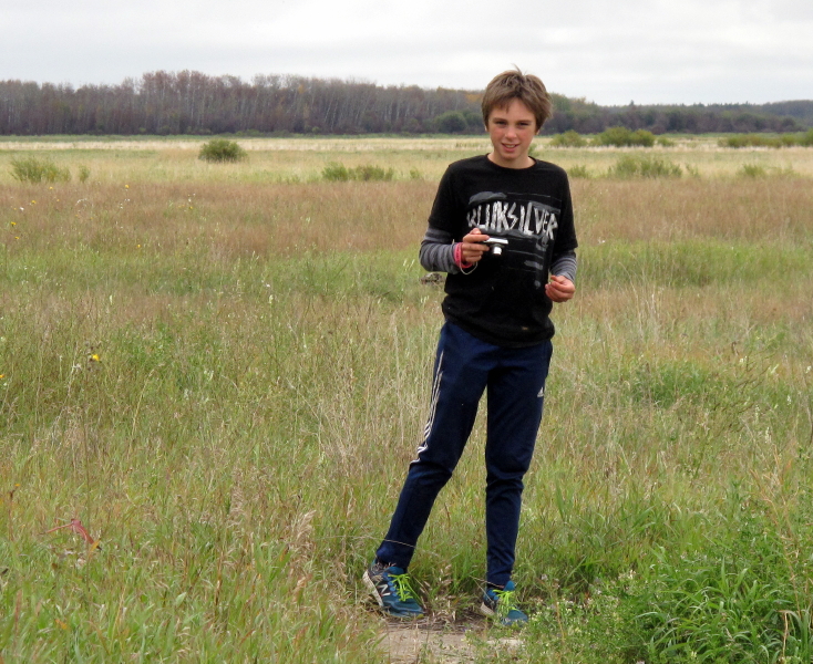 Josh searches for the perfect shot in fields of sweetgrass