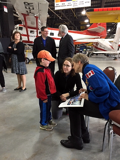 Dr Bondar speaks with a young fan, Zackary and his Mom Lesley