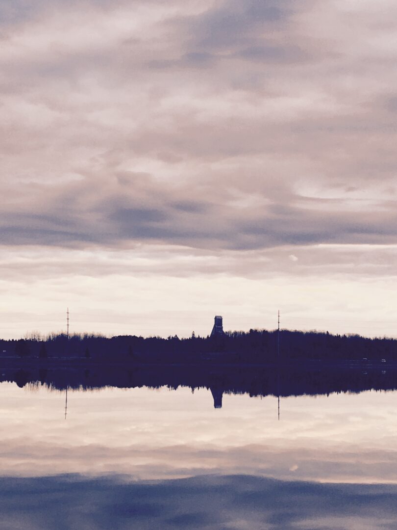 Image of sky reflected on lake