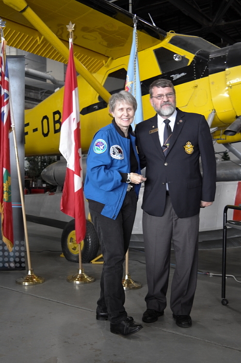 Dr Bondar becomes an honorary Air Cadet with pin presented by Craig Hawkins, Air Cadet League of Canada, Ontario Provincial Committee