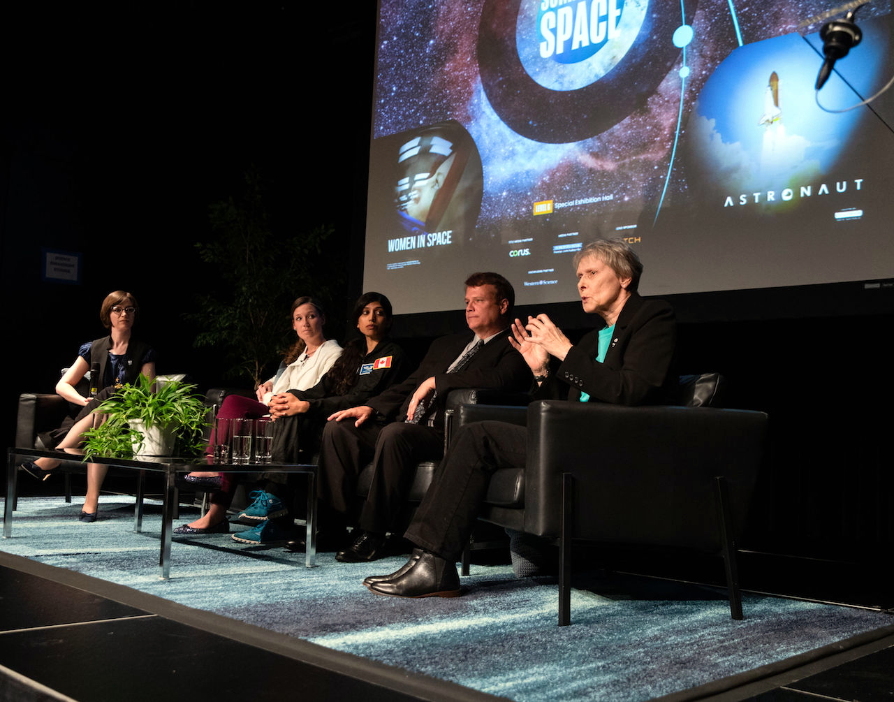 Image of a panel of people on stage
