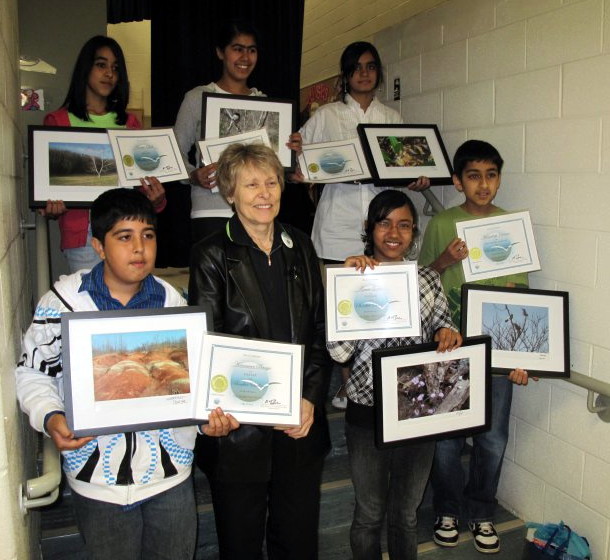 Dr Bondar with SBBC winners who hold their Foundation certificates and their winning images framed & mounted as art prints