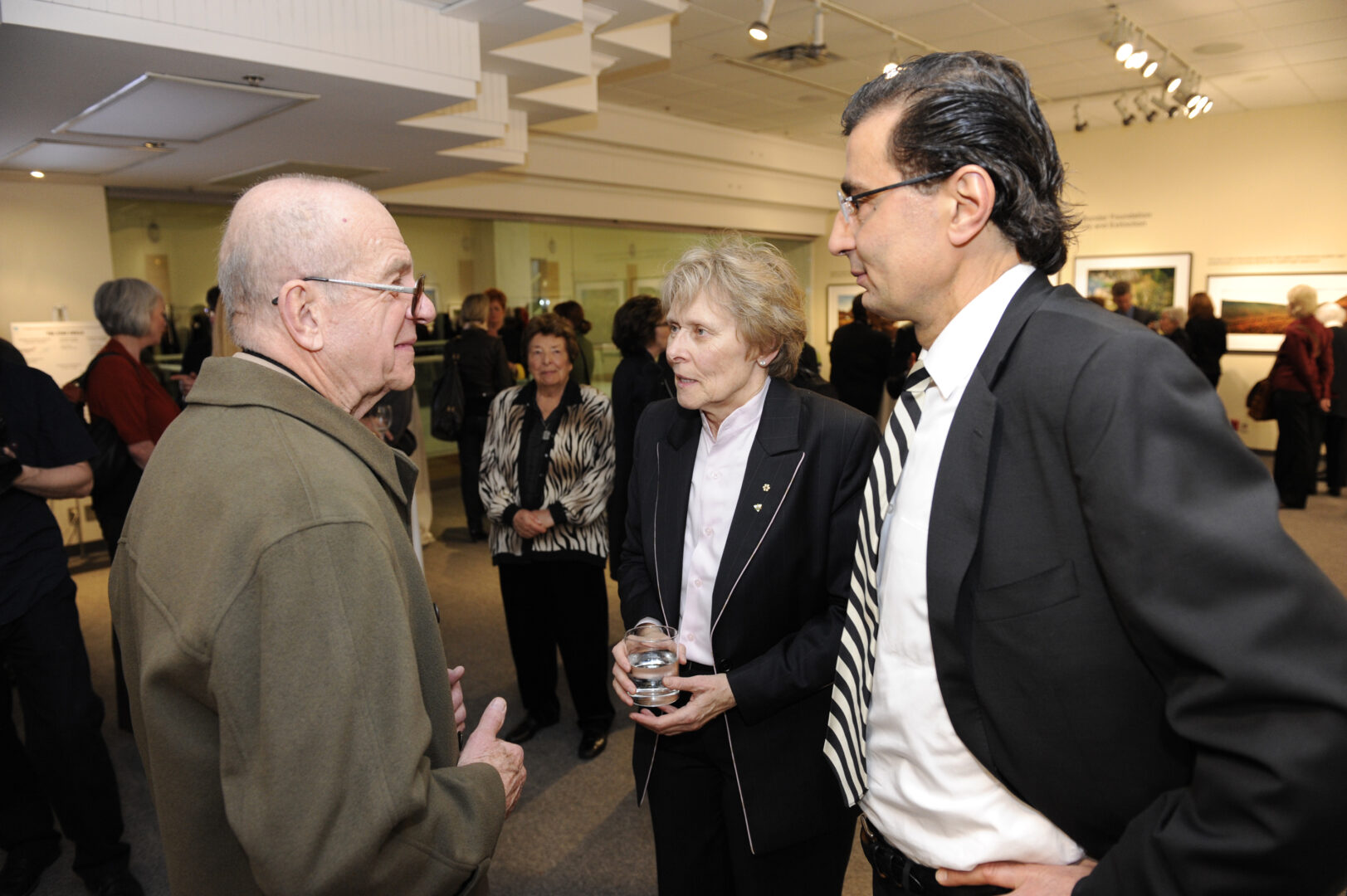 Dr. Bondar talking to people in a gallery