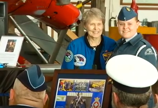 Dr Roberta Bondar and 155 Air Cadet Sqn. Cadet WO1 Christiane Boudreau behind the plaque