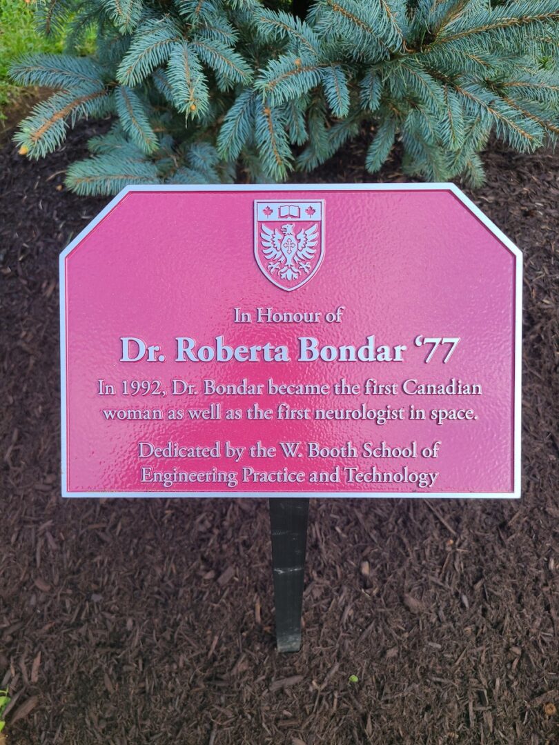 Plaque reading: "In Honour of Dr. Roberta Bondar '77. In 1992, Dr. Bondar became the first Canadian woman as well as the first neurologist in space. Dedicated by the W. Booth School of Engineering Practice and Technology."